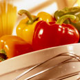 3 bell peppers in a basket